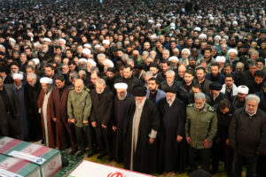 lady carrying Hamas leader Haniyeh photo.